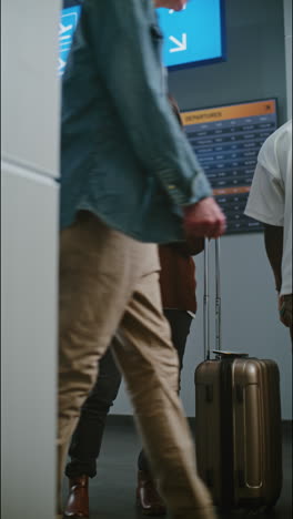 woman at airport checking flight information