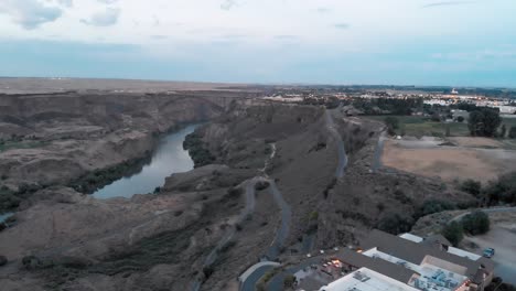 slow aerial panoramic view of the snake river canyon in twin falls, idaho at dusk