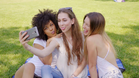 women grimacing and posing for selfie