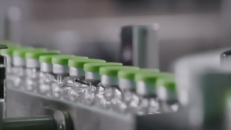 pharmaceutical production line medicine bottles amber glass vials on production line of clean laboratory pharmaceutical plant environment