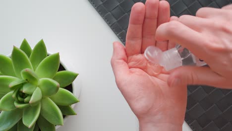 man sanitizing his hands with hand sanitizer