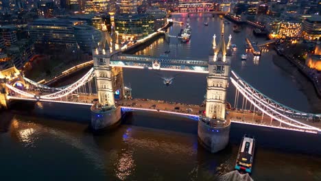 Dolly-in-tilt-down-drone-shot-of-the-Tower-Bridge-in-London,-England