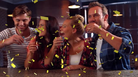 Enjoying-drinks-at-bar,-friends-with-confetti-animation-celebrating-together