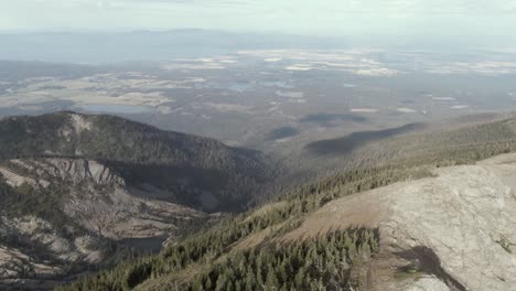 flying over the mountains of montana in to the valley of flathead lake