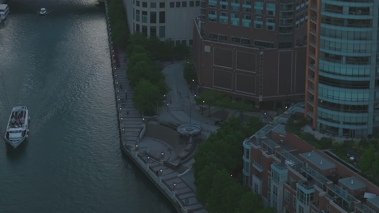 View of Chicago river from above with a boat traveling in the water
