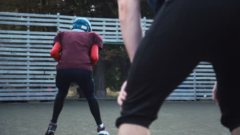 american football players training and running on an outdoor field