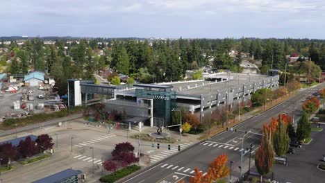 aerial view on lakewood sound transit station along pacific highway, southwest lakewood, washington, united states - drone shot