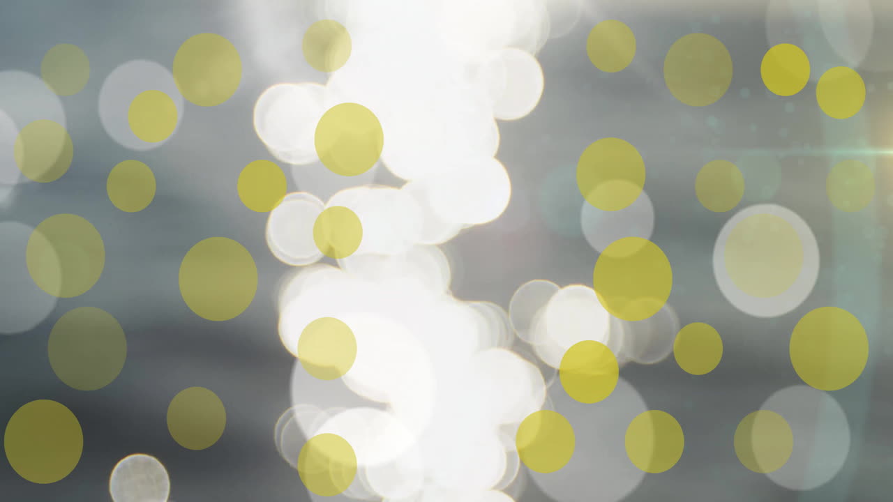 회색 배경 위에 움직이는 반이는 빛 점의 애니메이션