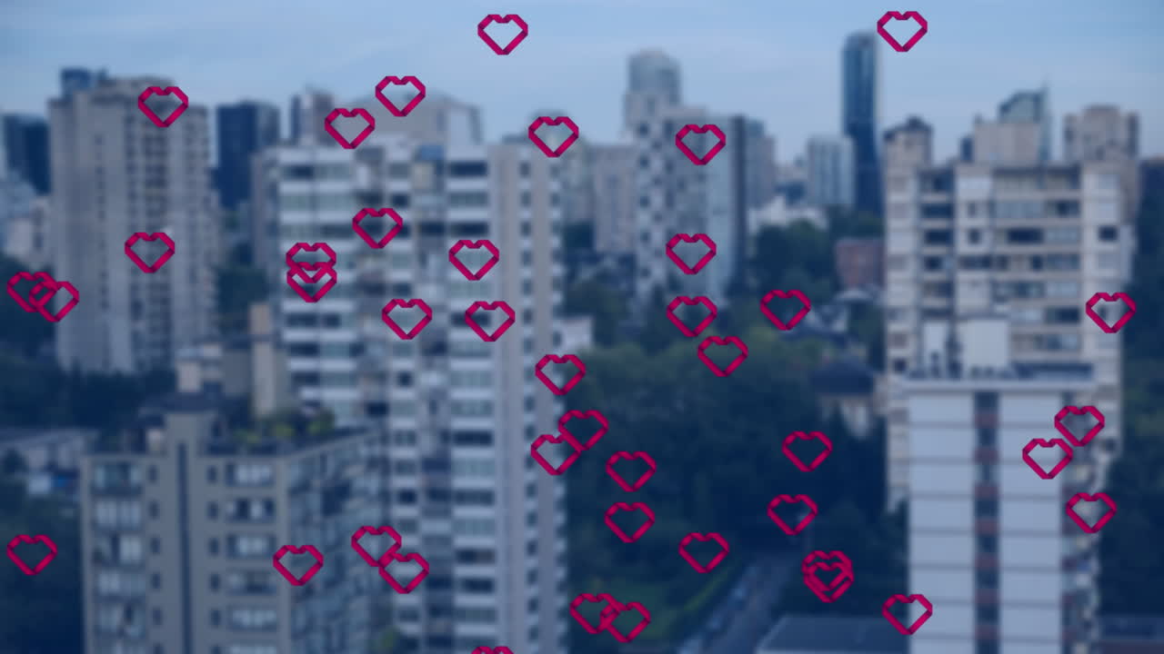높은 건물의 공중 시야에 떠다니는 여러 개의 빨간 심장 아이콘의 애니메이션