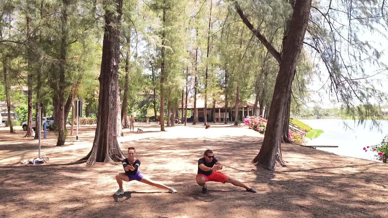 Couple exercising outdoors in a park