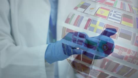 animación de un globo de banderas mundiales y el médico se pone los guantes