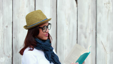 smiling hipster woman reading a book