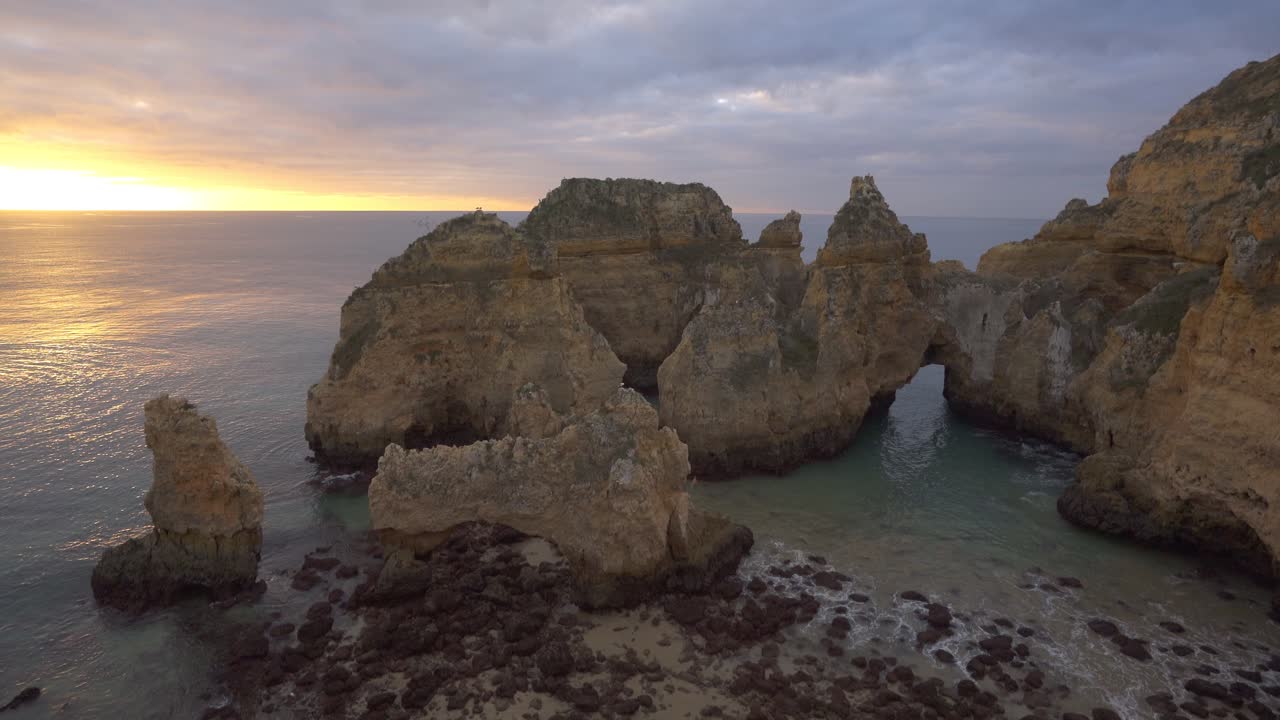 Sunrise over Dramatic Coastal Cliffs and Rock Formations