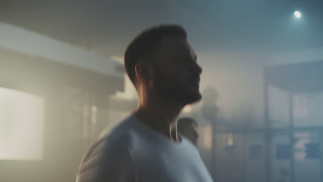 Man in a white t-shirt indoor portrait