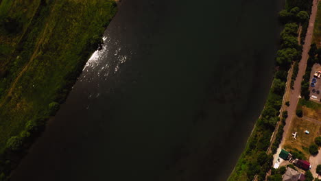 Aerial-drone-landscape-view-of-the-historc-Soroca-Fortress,-on-the-riverside-of-Dniester-river-crossing-Moldova