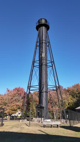 tourists at finns point rear range lighthouse vertical in pennsville, new jersey