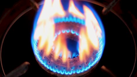 firing the gas burner with a lighter, close up