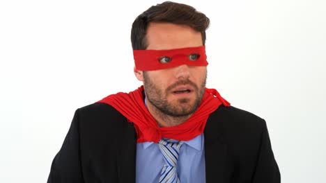 surprised businessman pretending to be a super hero