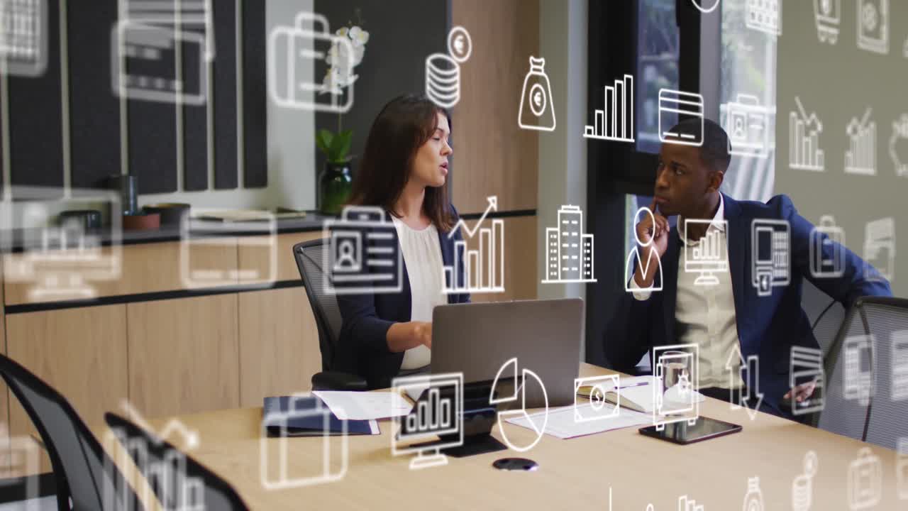 Animation of multiple icons over diverse female sharing ideas with coworker on laptop in office