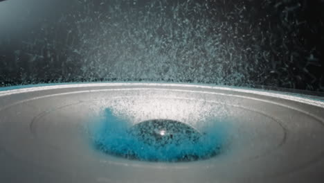 bright blue powder flies up near dust cap of modern dynamic