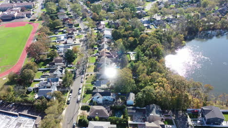 a drone view over grant pond in a long island, ny suburb