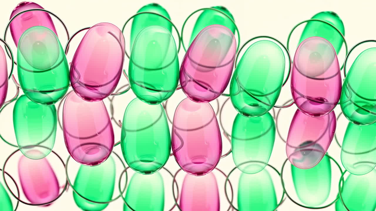 Rotating Abstract Pattern of Pink and Green Translucent Capsules
