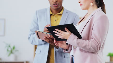 Tablet,-notebook-and-business-people-in-discussion