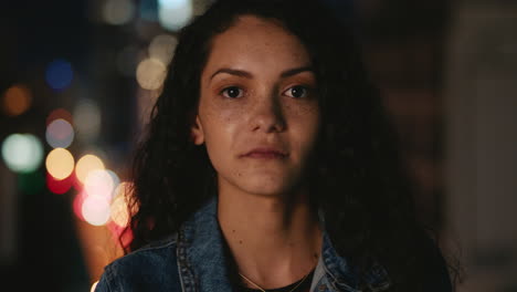 portrait-of-beautiful-young-hispanic-woman-on-rooftop-at-night-with-bokeh-city-lights-in-urban-skyline-background