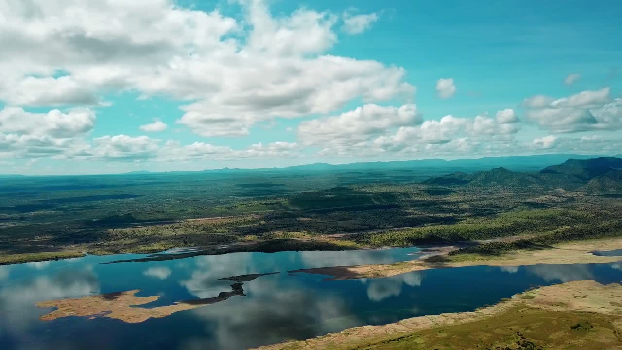 Blue Sky And Clouds Reflecting At Lake Magadi With Its Beautiful Surroundings In Kenya - drone orbit
