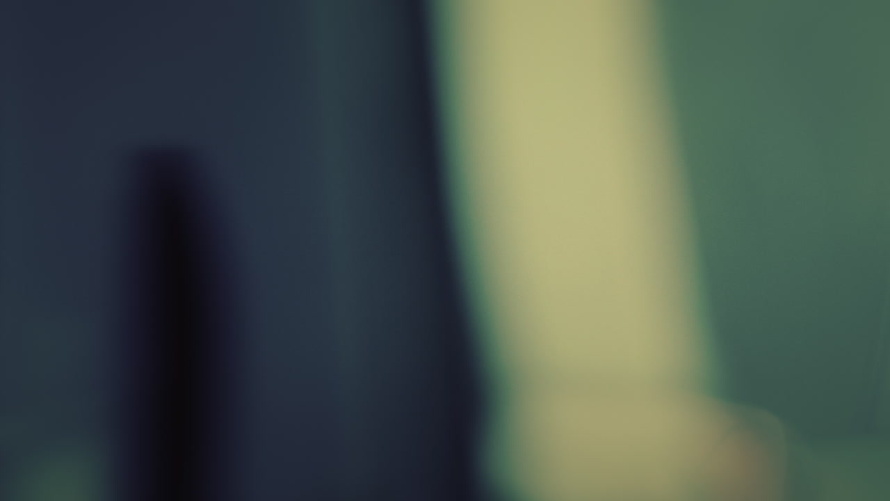 A Stunning Asian Fashion Model Wearing a One-shoulder Top Poses Inside the Car - Reveal Shot