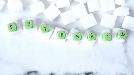 sugar cubes and wooden letters