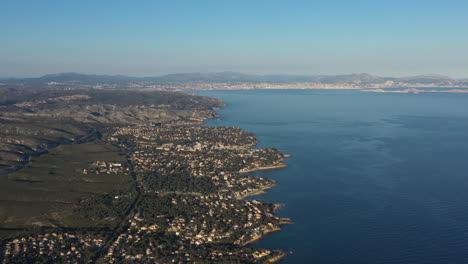 Mediterranean-coastline-shore-and-sea-Marseille-in-background-sunset-France-blue