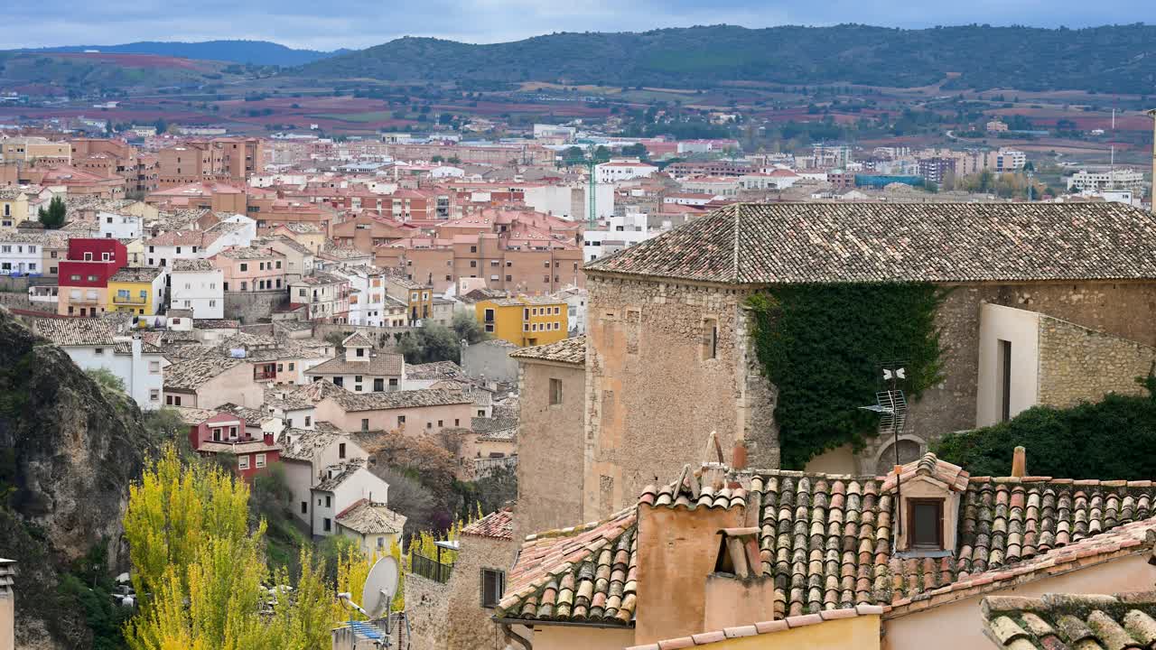 CUENCA, SPAIN - A panoramic view of the historic city nestled among the hills. The famous cliffside architecture of the UNESCO World Heritage town on an overcast day.