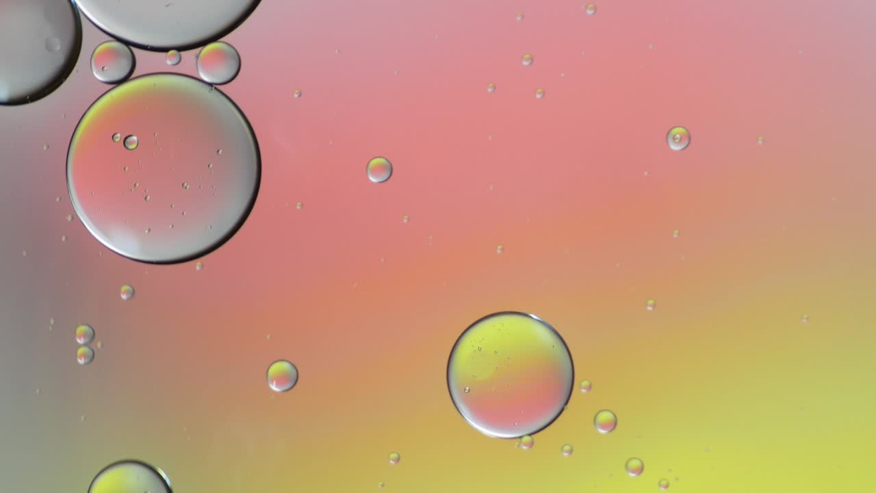 Colorful artistic of oil drop floating on the water.