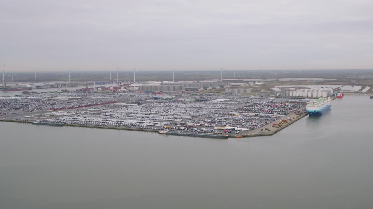 Industrial cargo harbor on moody day in Belgium, aerial view