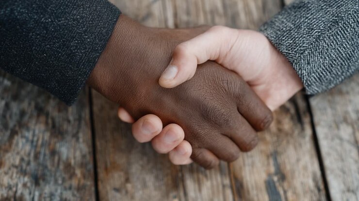 A Symbol of Unity: Two Hands, One Agreement – Exploring Connections Through Handshaking Across Cultures and Differences