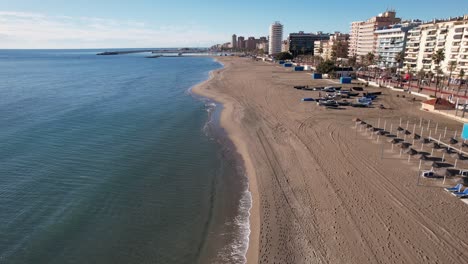 centered fly over of the shore at los boliches beach in fuengirola, spain