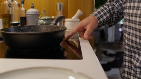 person checking a hot plate