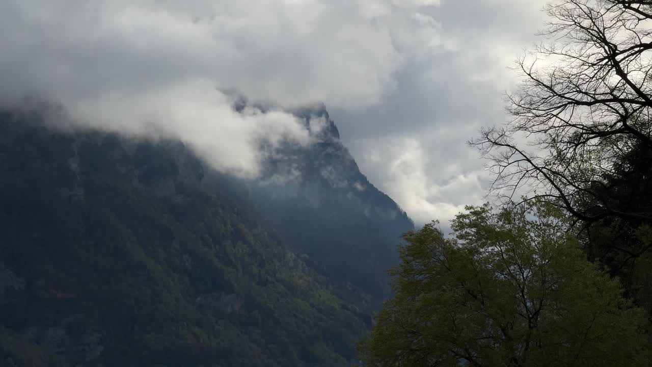Low level clouds above Swiss Alps mountains nature geography landscape Switzerland