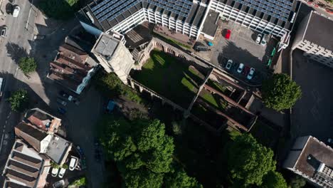 Descending-crane-drone-shot-of-temple-church-ruins-bristol