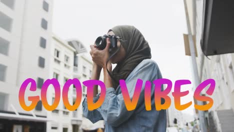 animation of text vibes over woman taking photo