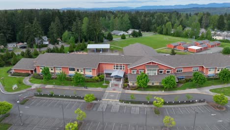 aerial of a new elementary school with an empty parking lot