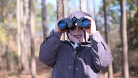 a boy explores woods with binoculars discovering natures wonders a young boy explores the serene woods with binoculars capturing glimpses of wildlife and the beauty of nature inviting viewers to join his adventure