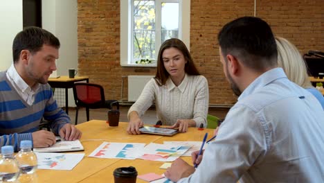 business team meeting involved diverse people participating in creative sustainable ideas steadicam shot across boardroom table shared work space