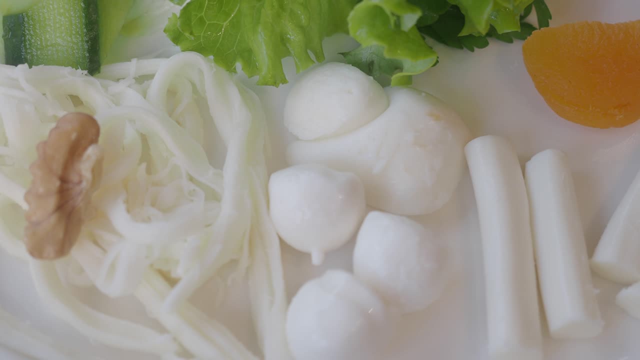 Fresh salad with mozzarella, vegetables and walnut