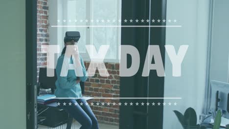 tax day text banner against indian woman wearing vr headset at office