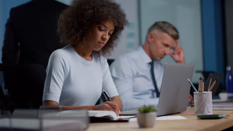 african american business woman working in open space