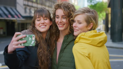 group of cheerful friends taking a selfie