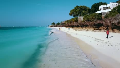 buttery soft fast aerial flight coastline white sand beach crystal clear blue water