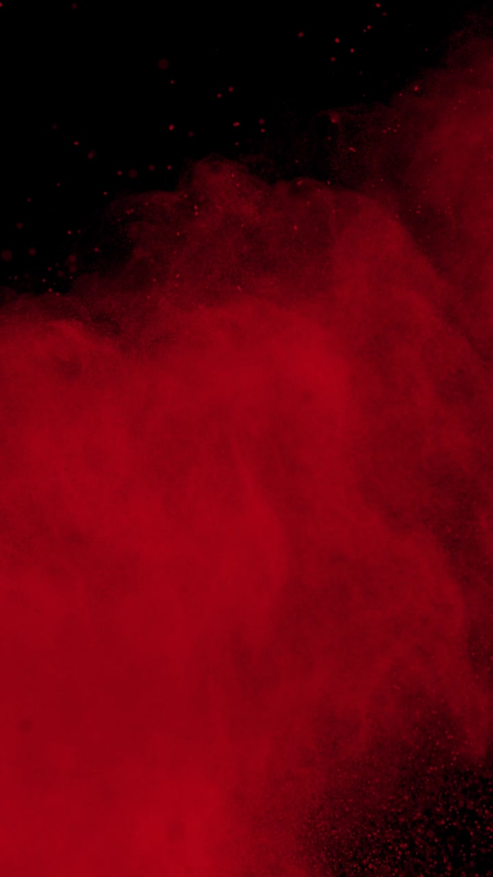 Super Slow Motion Shot of Red Color Powder Explosion at 1000Fps Vertical View